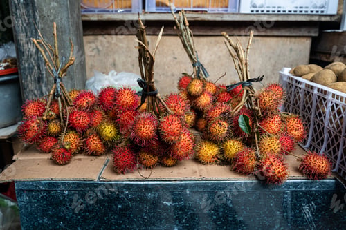 Preview: Fresh rambutan fruit sold at the market in daylight
