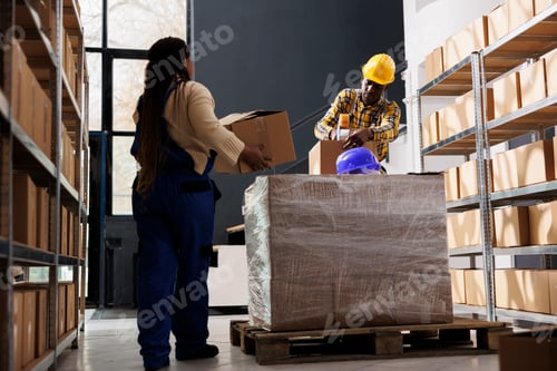 Preview: Package handler bringing parcels to warehouse worker for packing