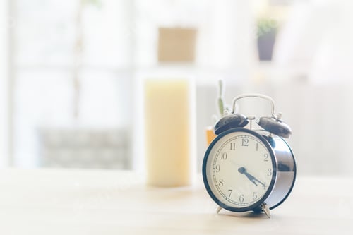 Preview: Morning sun. Alarm clock on a beautiful background