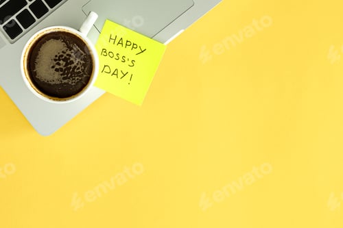 Preview: Boss day concept, laptop and cup of coffee on a yellow background, flat lay.