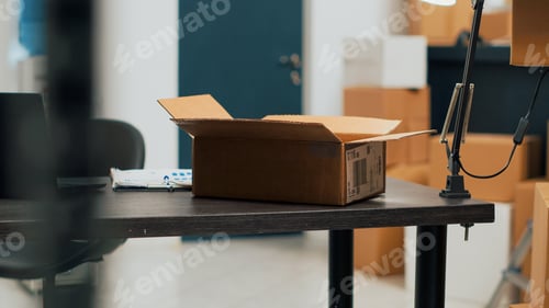 Preview: Empty warehouse office space filled with cardboard boxes and products