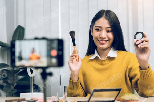 Preview: Beautiful asian woman blogger using camera