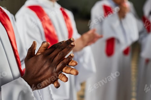 Preview: Man clapping while singing in church choir