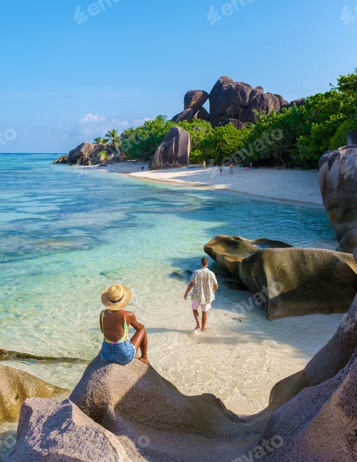 Preview: Anse Source d'Argent, La Digue Seychelles, a young couple of men and women on a tropical beach