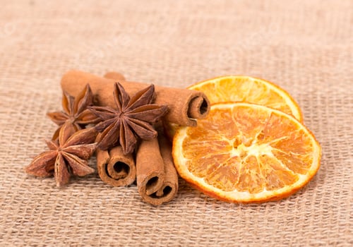 Preview: Cinnamon and oranges isolated on tissue background