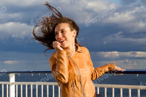 Preview: photo session of a young, beautiful, happy girl on a sea voyage on a motor ship