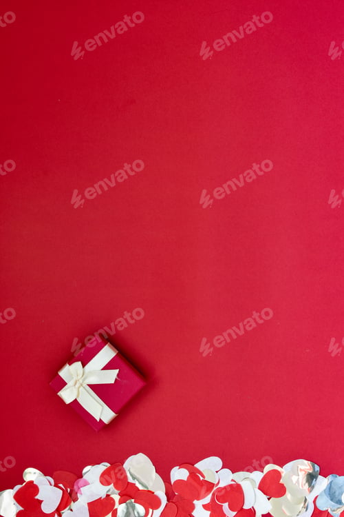 Preview: Hearts of paper on red textured background. San Valentine day concept.