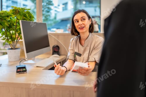 Preview: Pharmacist attending and talking with a client in the counter