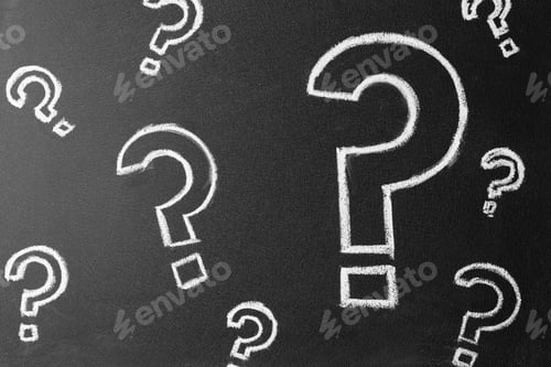 Preview: Question marks drawn with chalk on blackboard, top view