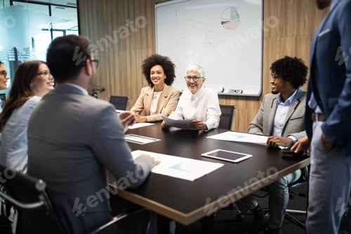 Preview: Group of successful business people at work in office