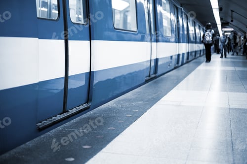Preview: Colorful Underground Subway Train with blurry people in the back