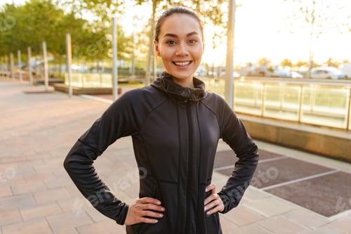 Preview: Cheerful beautiful young asian sports woman