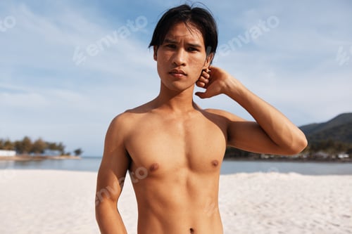 Preview: Active Lifestyle: Muscular Asian Man Enjoying Sunset Run on Beach