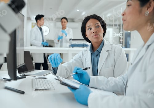 Preview: What do you think. Shot of two scientists helping one another in the lab.