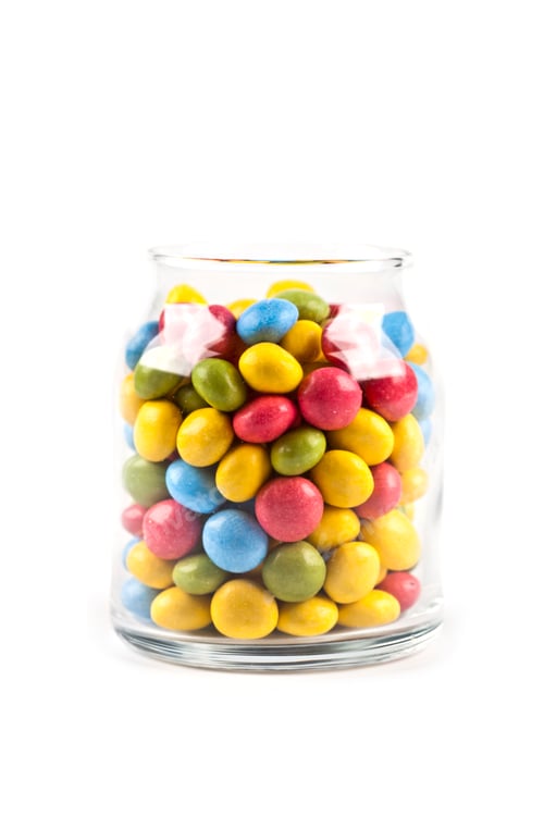 Preview: Colorful sweet candies in glass jar isolated on white.