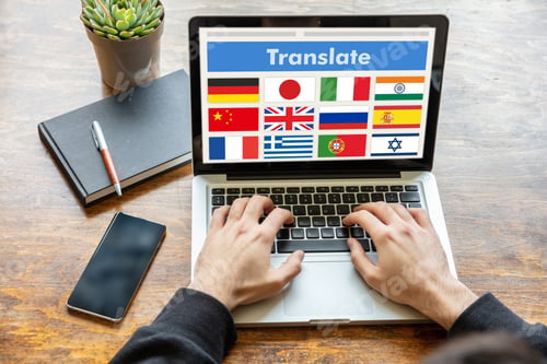 Preview: Man working on a laptop with the word translate on the computer screen