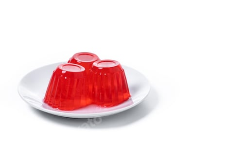 Three Red Jello Cups on a Plate