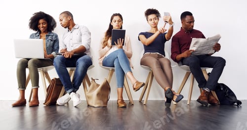 Preview: Shot of a group of diverse businesspeople waiting in line for an interview