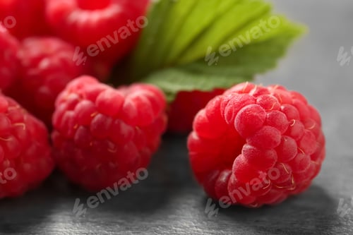 Preview: Ripe aromatic raspberries on table, closeup