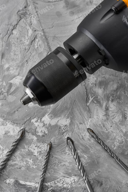 Preview: Set of borers and drill, concrete background