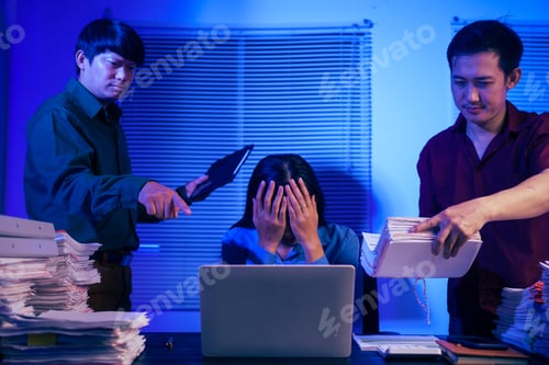 Preview: Two men bring a large workload to a woman at her desk in the office. She feels stressed pressured