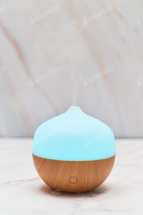 Preview: Aroma oil diffuser on table at home. Aromatherapy concept