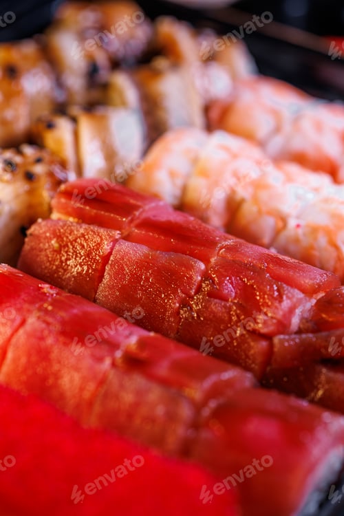 Preview: A set of delicious sushi rolls Red caviar on sushi rolls.