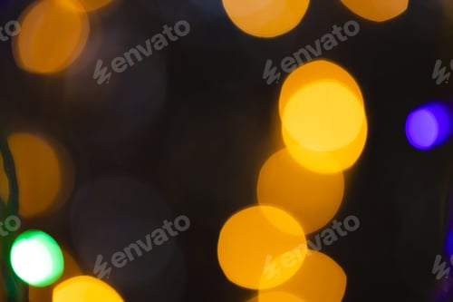 Preview: Multiple yellow and blue bokeh lights with copy space on dark background