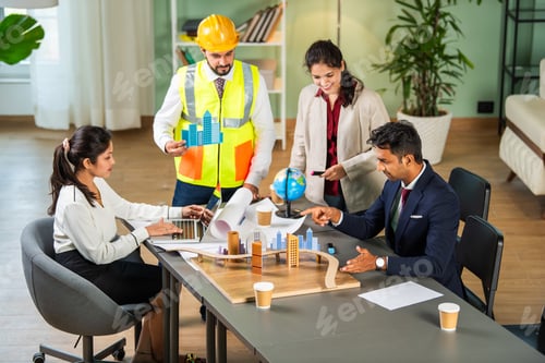 Preview: Indian asian Architect, builder and engineer in a team meeting discussing construction projects