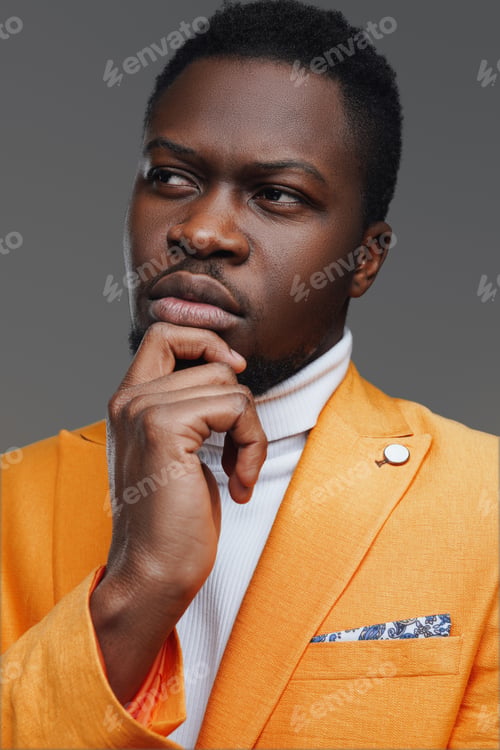 Preview: African fashion guy with his finger on his chin
