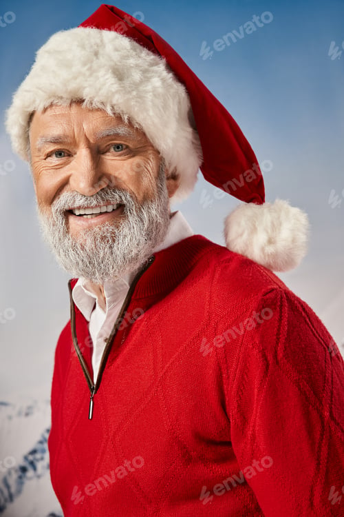 Preview: portrait of happy Santa with white beard in red hat smiling cheerfully at camera, winter concept