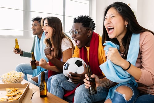 Preview: Multi ethnic young football fans people supporting their national team on TV