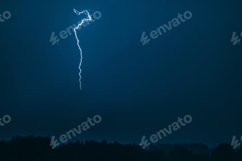 Preview: Lightning in sky over city. Bright flashes on dark night.