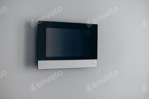 Preview: A video intercom screen on a white apartment wall