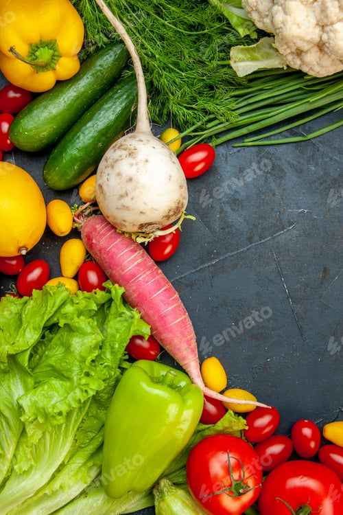 Preview: top view fresh vegetables cherry tomatoes cumcuat cauliflower radish green onion parsley cucumbers