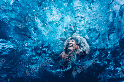 Preview: Woman behind pure blue ice