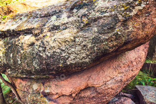 Preview: An unusual stone in the sun in warm weather in the beautiful nature