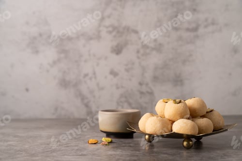 Preview: Traditional indian sweets burfi on concrete background