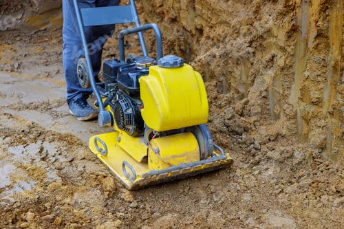 Preview: Vibratory plate compactor in construction rammer ground compaction of underground foundation pit for