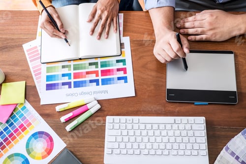 Preview: Two colleague creative graphic designer working on color selection and color swatches