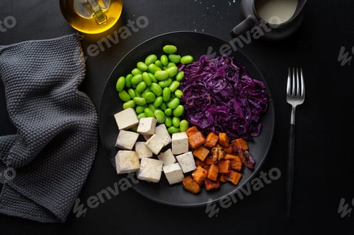 Preview: Appetizing vegan bowl with tofu on plate
