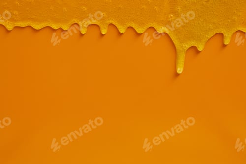 Preview: Cream liquid gel serum flowing down on yellow texture