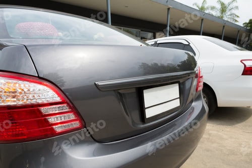 Preview: Close up back of 2 cars parking on the road