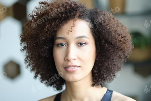 Preview: Close up portrait of cute stylish African American woman with beautiful face. Elegant fashion model.