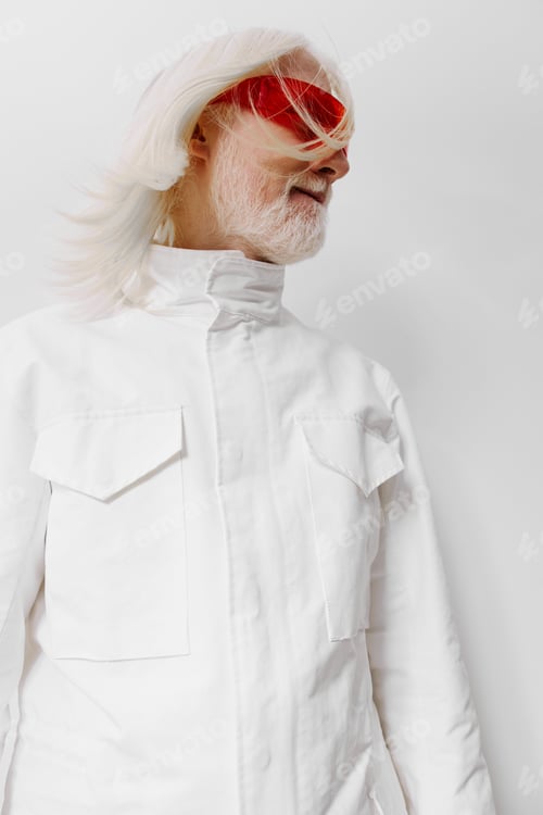 Preview: Fashion portrait of an elderly man in a stylish white outfit with red sunglasses, featuring a