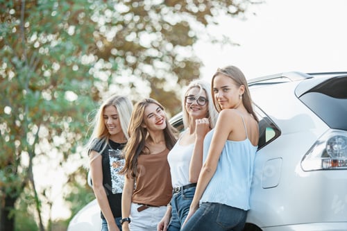 Preview: The Young Women Standing Near The Car
