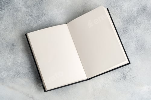 Preview: Blank open notepad on gray background studio shot