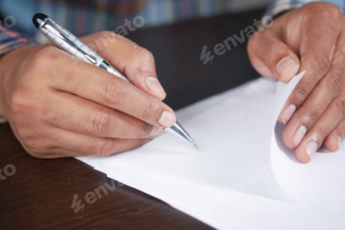 Preview: man hand in fountain pen writing or signature on paper .