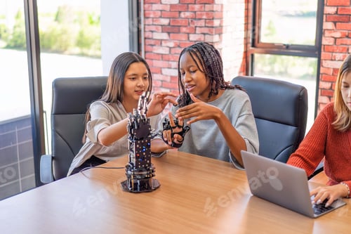 Preview: Teenager children learning with new innovation robotic hand interface hand control in classroom