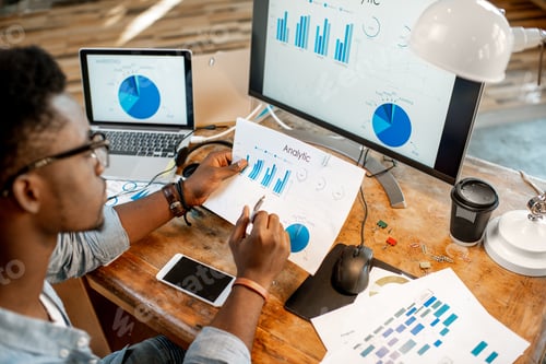Preview: Man working with analytics at the office